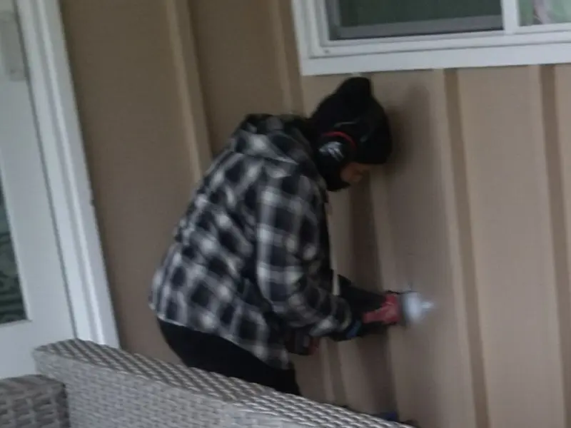 Professional electrician installing an exterior outlet in American Falls